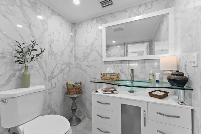 bathroom with toilet and vanity