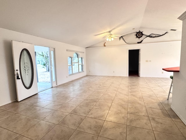 interior space featuring ceiling fan and vaulted ceiling