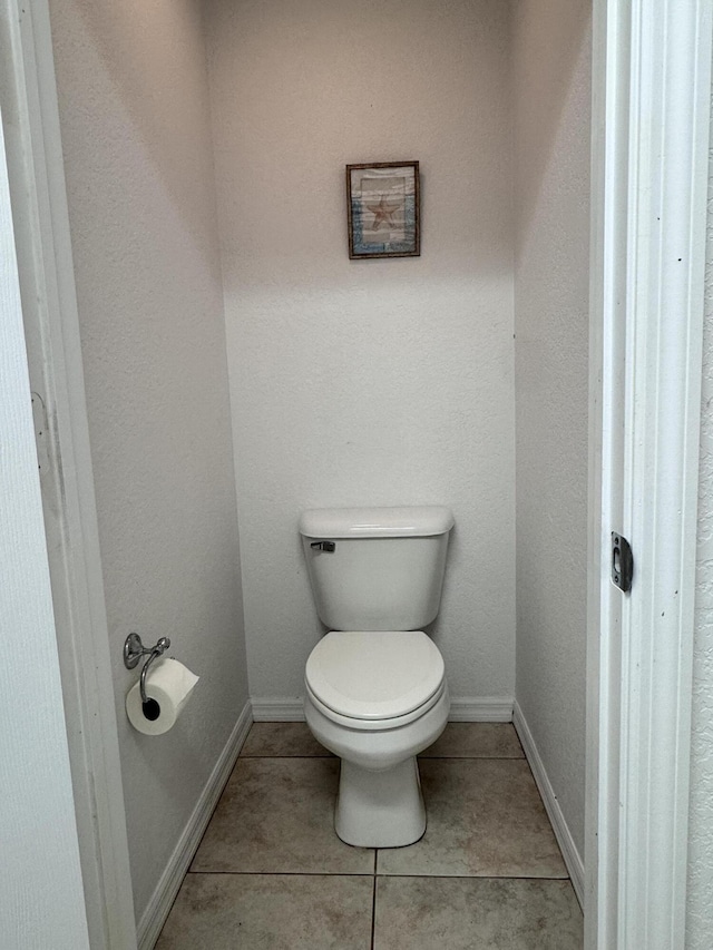 bathroom with tile patterned floors and toilet