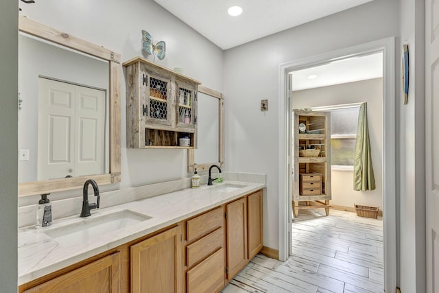 bathroom featuring wood-type flooring and vanity