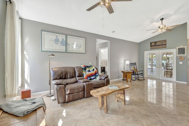 living room with ceiling fan, lofted ceiling, a textured ceiling, and french doors