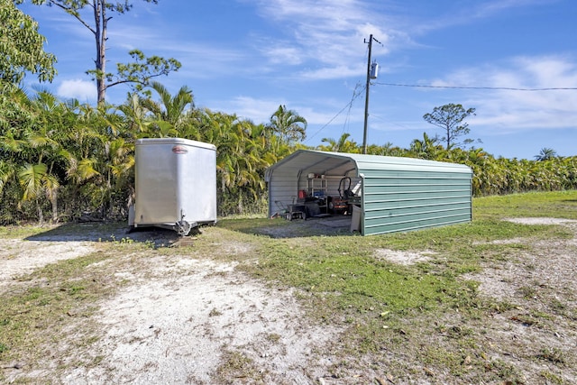 view of outbuilding with a carport