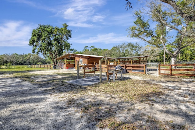 exterior space featuring a rural view and an outdoor structure