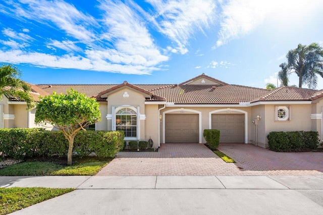 mediterranean / spanish-style home featuring a garage