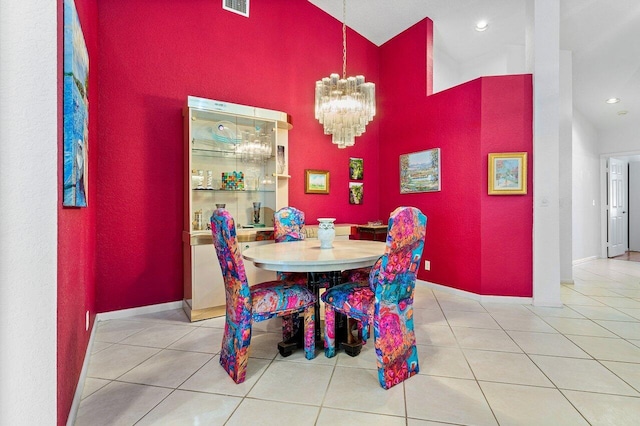 dining area with a notable chandelier and light tile patterned floors