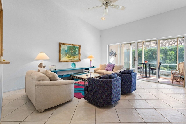 tiled living room featuring ceiling fan and high vaulted ceiling