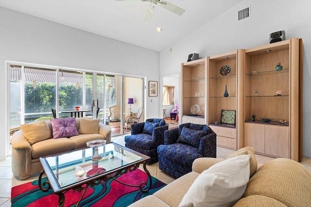 living room featuring ceiling fan, light tile patterned floors, and high vaulted ceiling