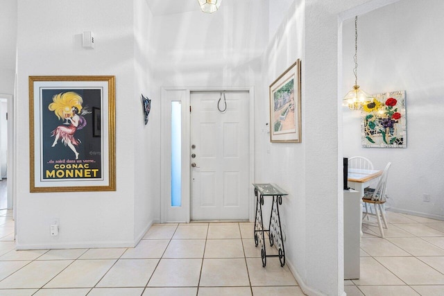 entrance foyer featuring a notable chandelier and light tile patterned floors