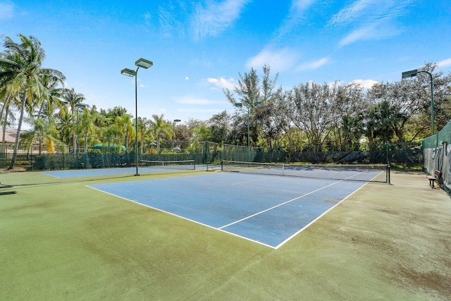 view of sport court featuring basketball hoop