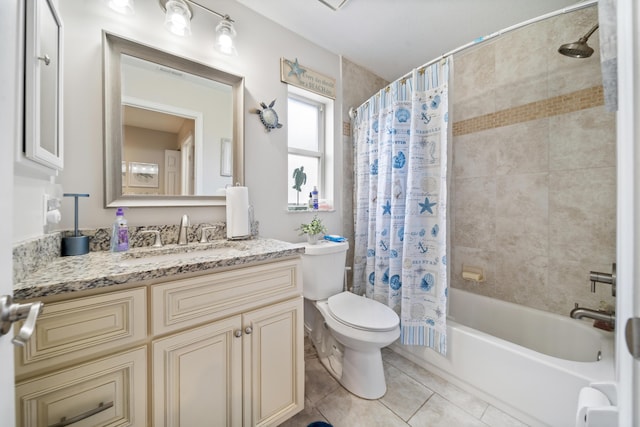 full bathroom with tile patterned floors, vanity, toilet, and shower / tub combo