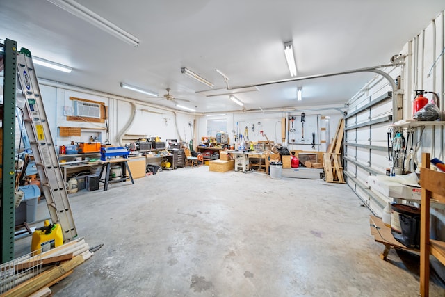 garage with a workshop area and ceiling fan