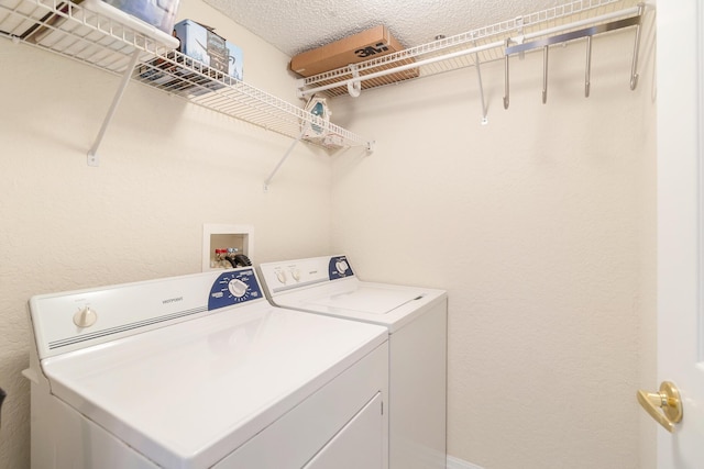 1801 N Flagler Dr Unit 840, West Palm Beach, FL 33407 - laundry room with washer and clothes dryer and a textured ceiling