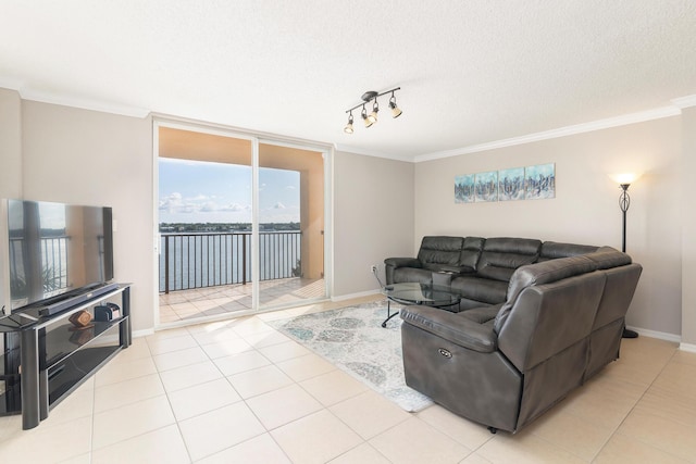 1801 N Flagler Dr Unit 840, West Palm Beach, FL 33407 - living area featuring ornamental molding, baseboards, light tile patterned floors, expansive windows, and a textured ceiling