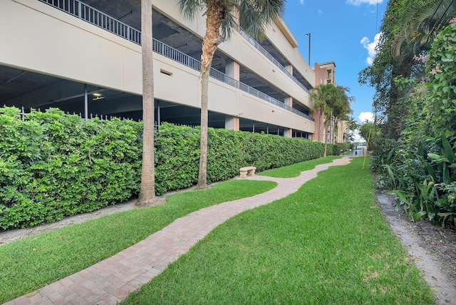 view of property's community featuring a yard