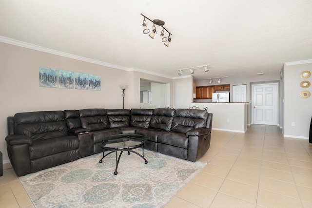 1801 N Flagler Dr Unit 840, West Palm Beach, FL 33407 - living room with light tile patterned floors, ornamental molding, baseboards, and rail lighting