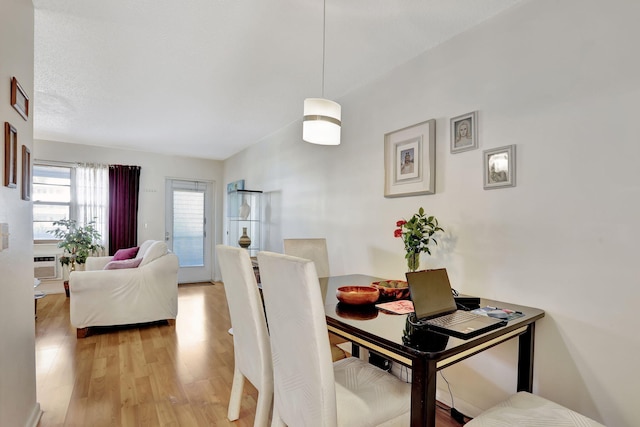 dining area featuring light wood-type flooring