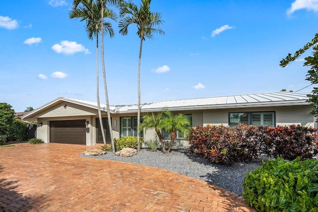 single story home featuring a garage