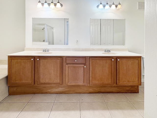 10320 SW Stephanie Way Unit 7-204, Port Saint Lucie, FL 34987 - full bath with tile patterned floors, double vanity, and a shower with shower door