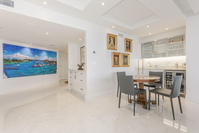 dining room with beverage cooler and indoor bar