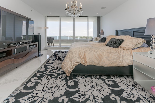 bedroom with an inviting chandelier, a wall of windows, and access to exterior