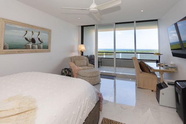 bedroom featuring ceiling fan and floor to ceiling windows