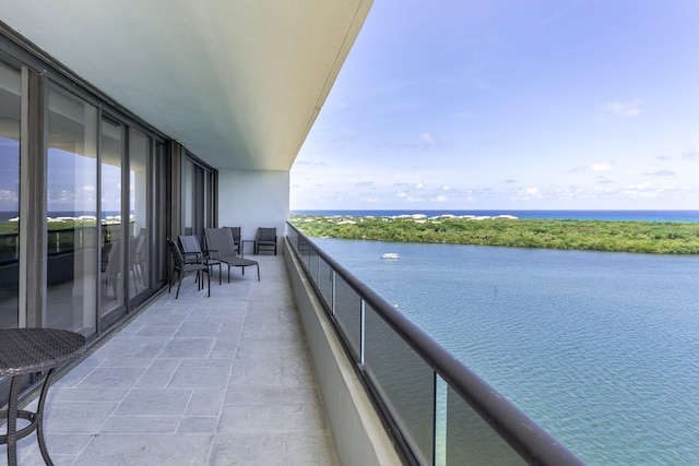 balcony featuring a water view