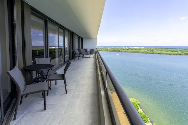 balcony featuring a water view