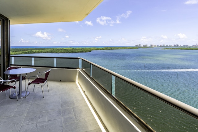 balcony featuring a water view