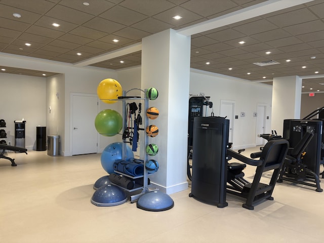 exercise room with a paneled ceiling