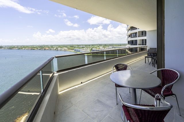 balcony featuring a water view