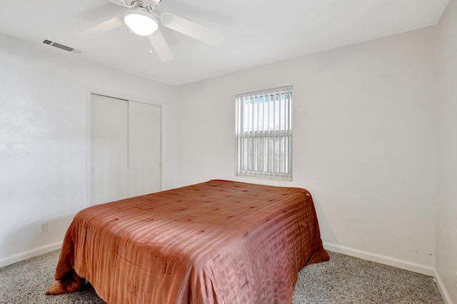 bedroom with carpet floors, ceiling fan, and a closet