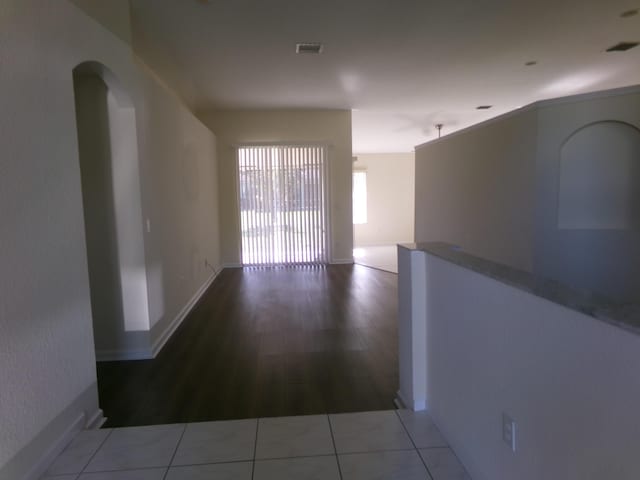 hall featuring tile patterned flooring