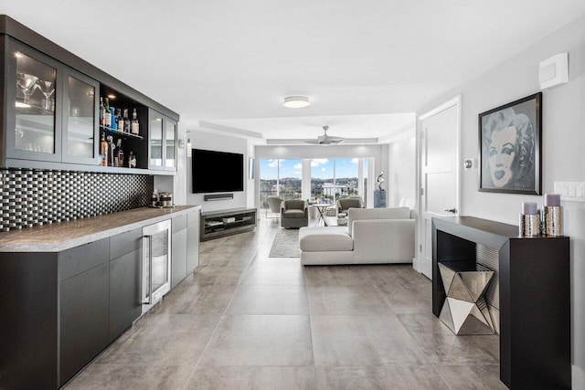 living room with beverage cooler and ceiling fan