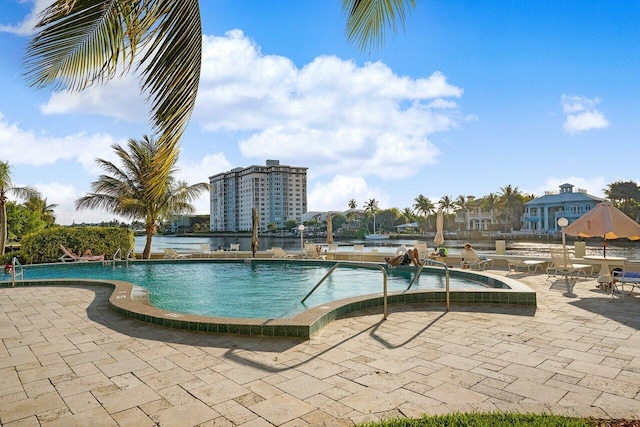 view of swimming pool featuring a patio area