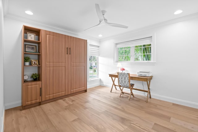 home office with ornamental molding, light wood-type flooring, and ceiling fan