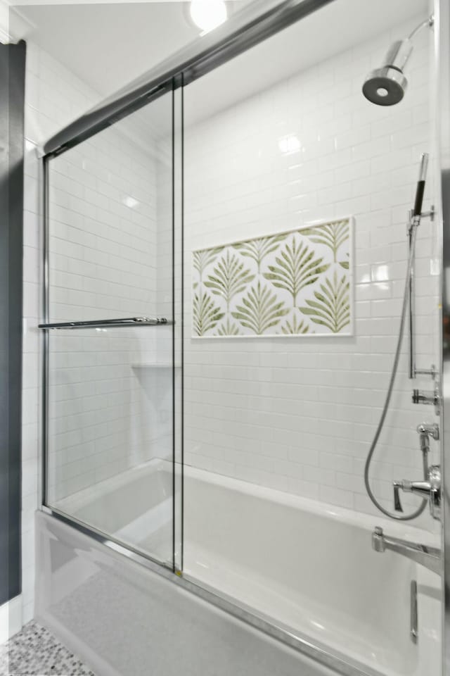 bathroom featuring tile patterned floors and enclosed tub / shower combo