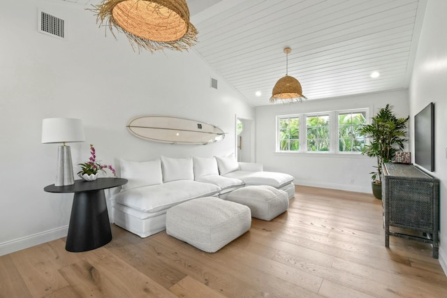 bedroom featuring lofted ceiling, wooden ceiling, and light hardwood / wood-style flooring