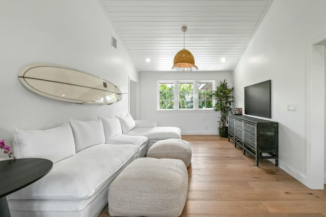 living room with wood ceiling and light wood-type flooring