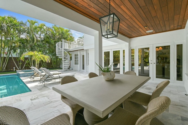 exterior space featuring wood ceiling and french doors