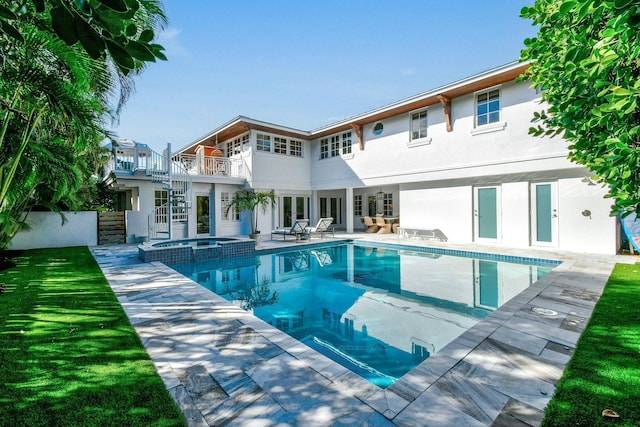 view of pool featuring an in ground hot tub and a patio