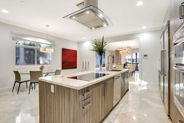 kitchen with island exhaust hood, stainless steel appliances, sink, pendant lighting, and an island with sink