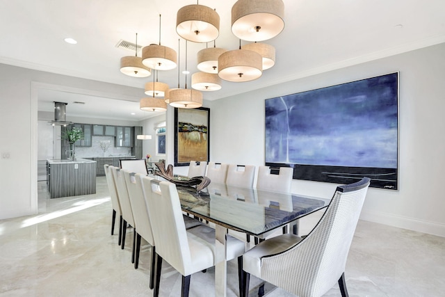 dining area featuring crown molding