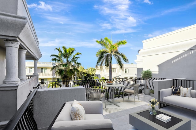 exterior space with an outdoor hangout area and a balcony