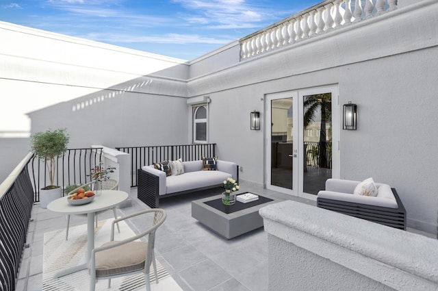 view of patio / terrace with french doors and an outdoor living space