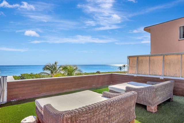 balcony featuring a water view