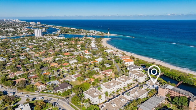 bird's eye view featuring a water view and a view of the beach