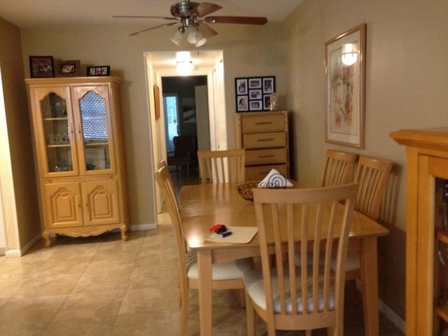 dining space featuring ceiling fan