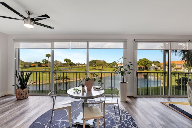 sunroom / solarium with a wealth of natural light and ceiling fan