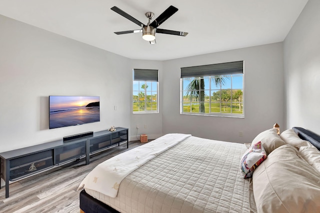 bedroom with wood finished floors and a ceiling fan