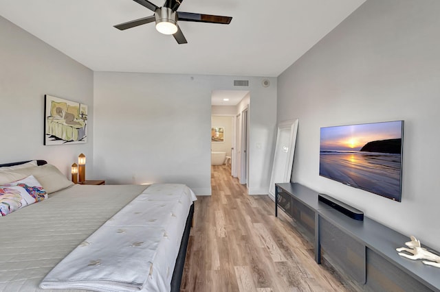 bedroom with visible vents, baseboards, light wood-style floors, and a ceiling fan